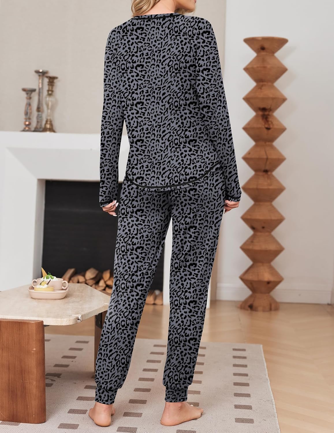 Black leopard long-sleeve pajama set with matching jogger pants and relaxed cuffs
