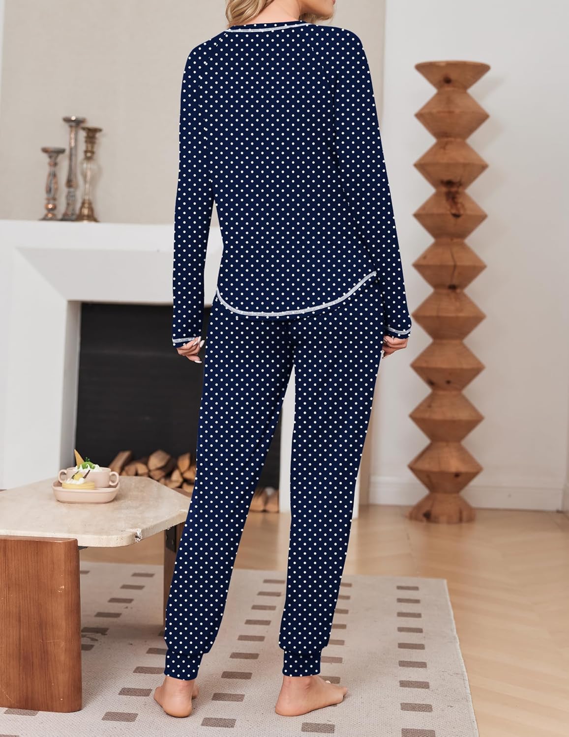 Navy polka-dot pajama set with contrast piping on cuffs and hem
