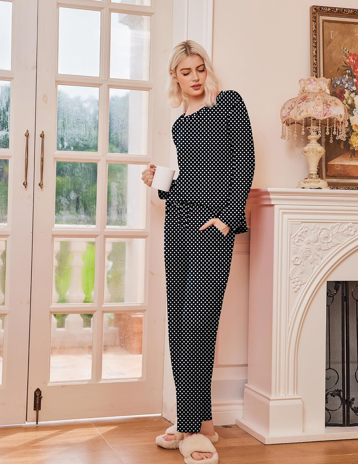 Black long-sleeve pajama set with white polka dots, full-length matching pants