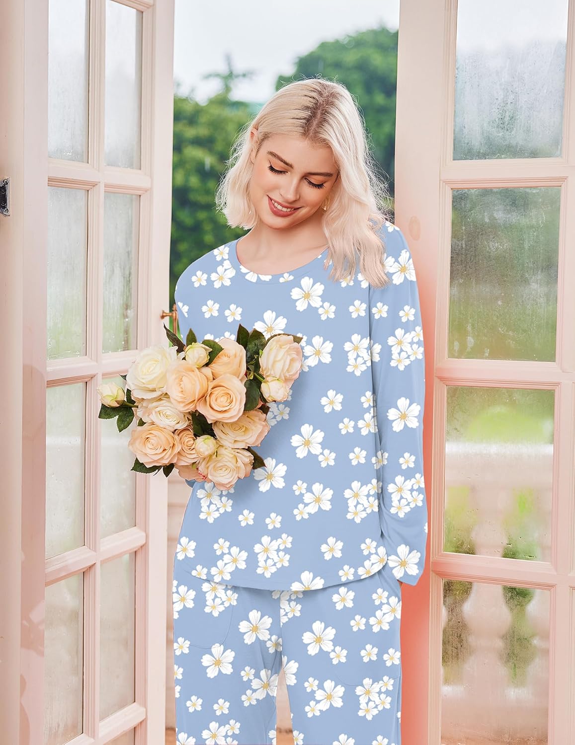 Light blue long-sleeve pajama set with white daisy pattern and matching pants