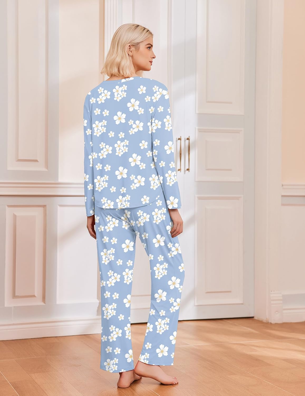 Light blue pajama set with white flower print, long sleeves and matching wide-leg pants