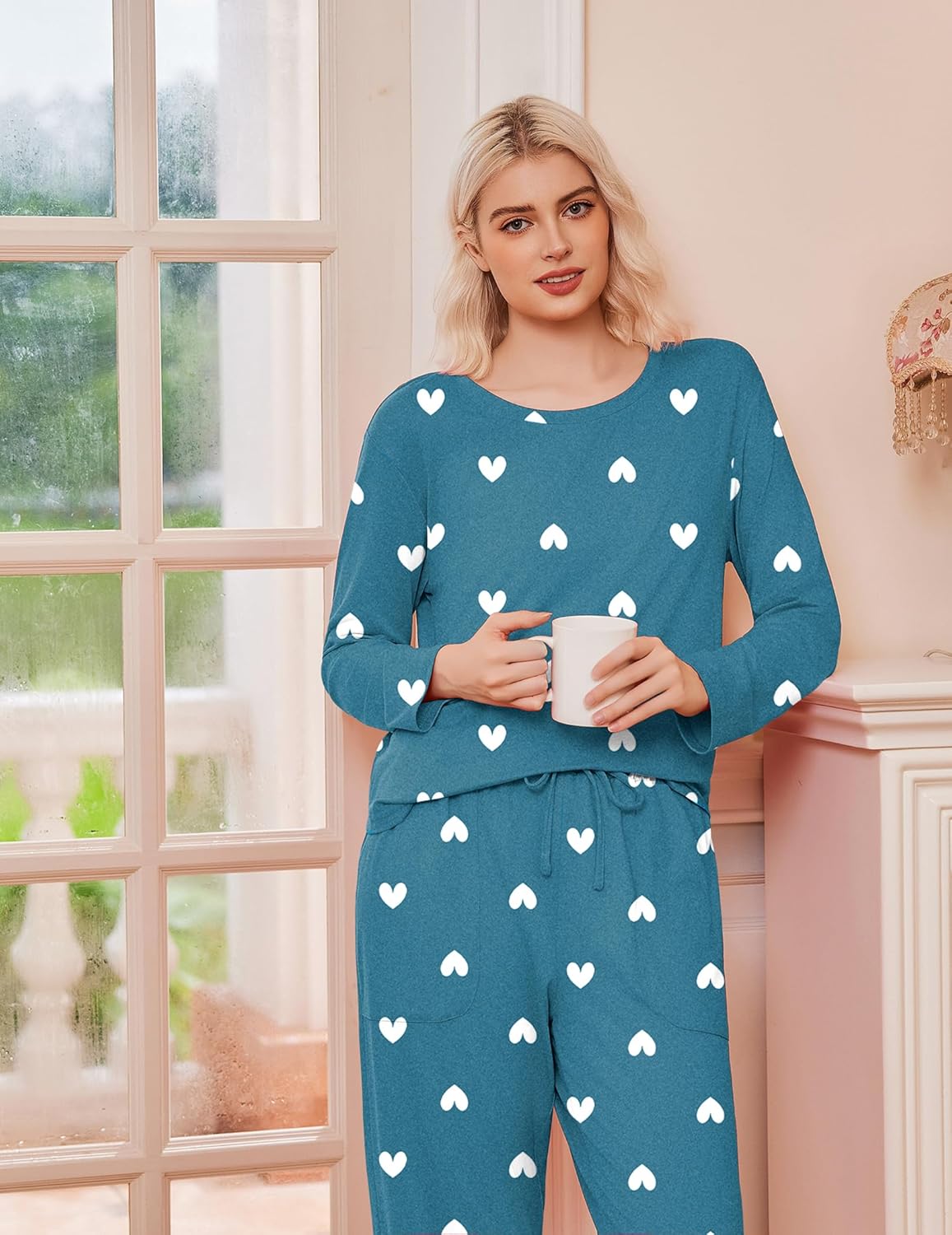 Blue-green pajama set with white hearts, long sleeves and drawstring pants