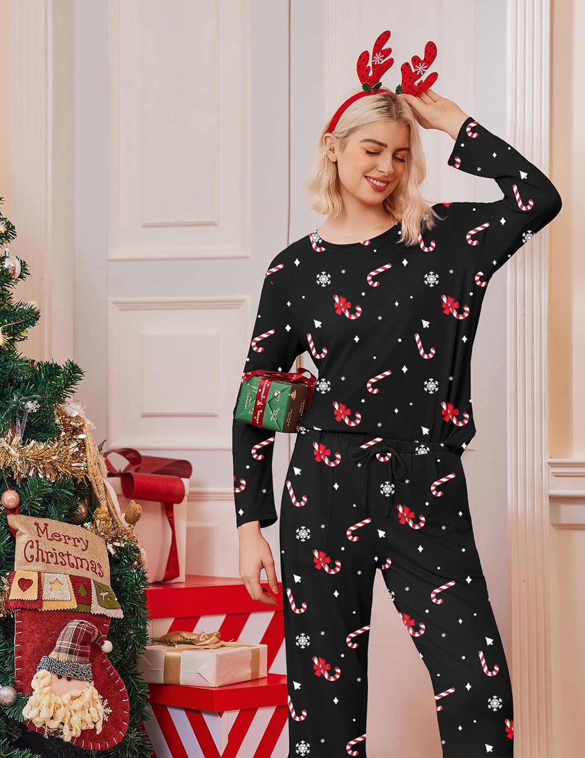 Black Christmas pajama set with red candy-cane and holly pattern, long sleeves