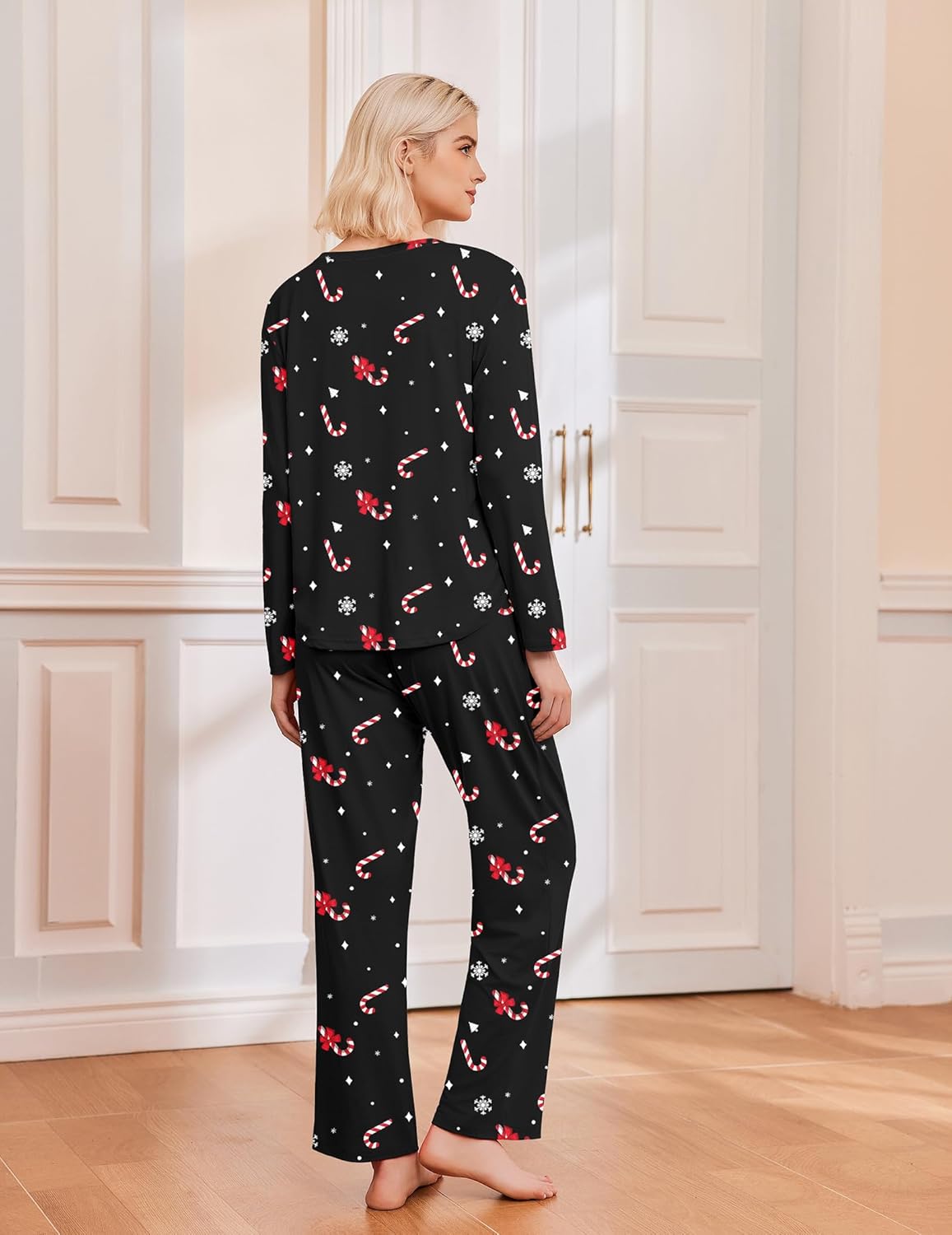 Black long sleeve pajama set with red candy-cane and snowflake motifs
