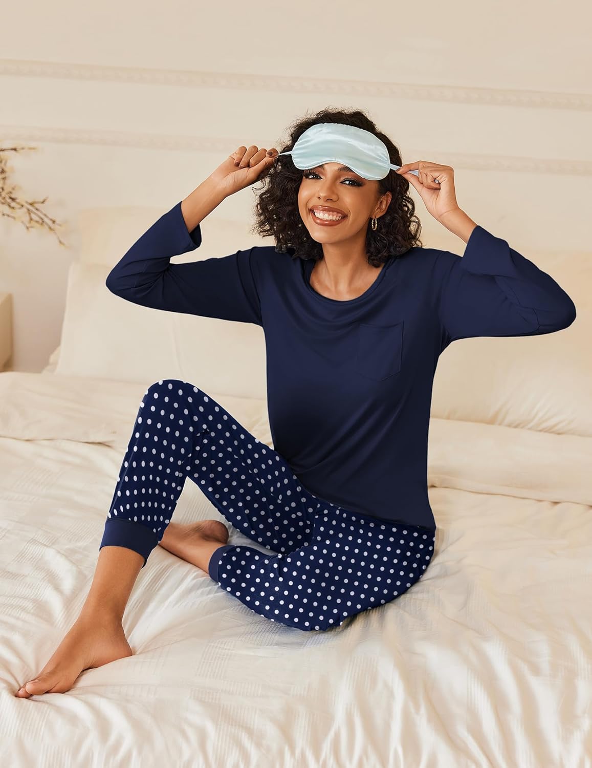 Long-sleeve pajama set: navy top and pants with white polka dots