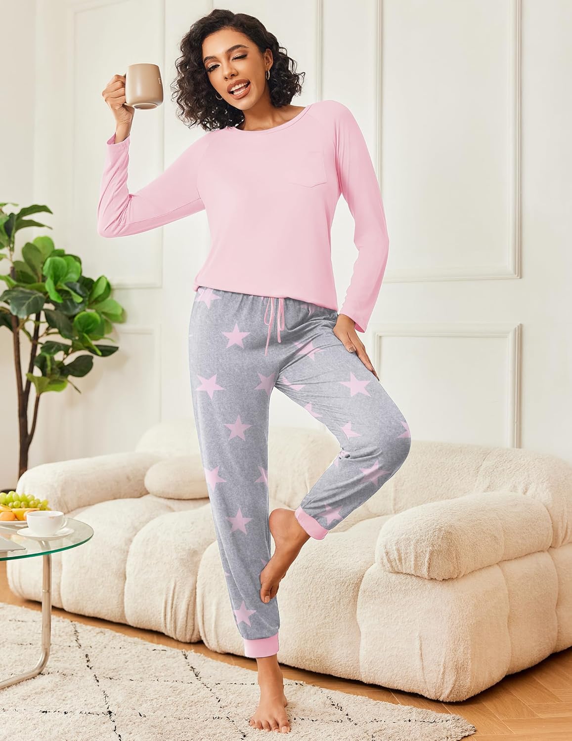 Pink long-sleeve pajama top with gray pants featuring pink star pattern