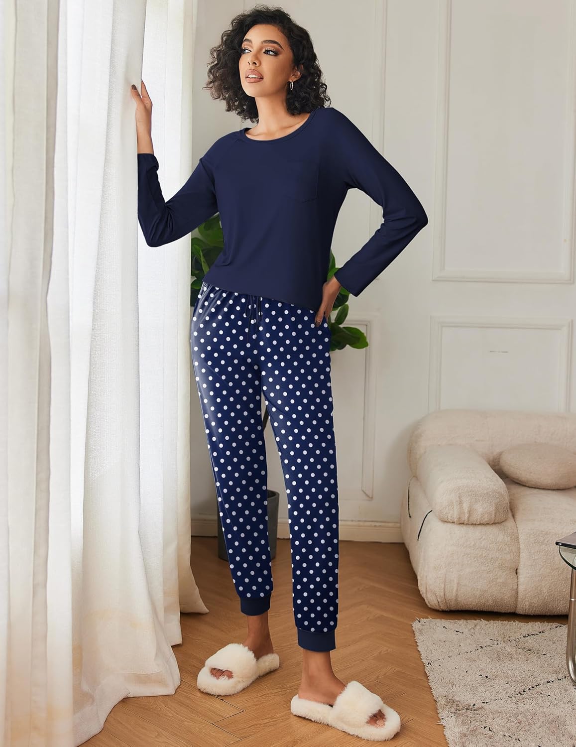 Navy long-sleeve pajama top with white polka-dot lounge pants