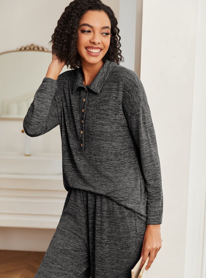 Dark gray knit lounge set with collar buttons, long sleeves, and draped lounge pants