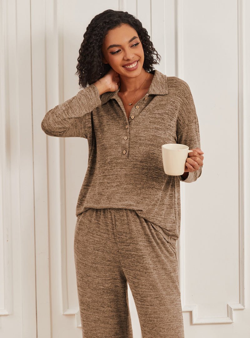 Camel knit lounge set with button-front top and matching pants, holding a mug