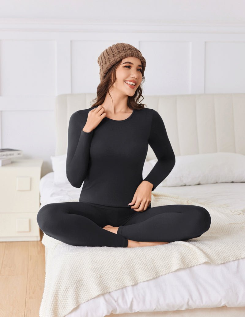 Black thermal set: long-sleeve top and full-length leggings, smooth fitted fabric