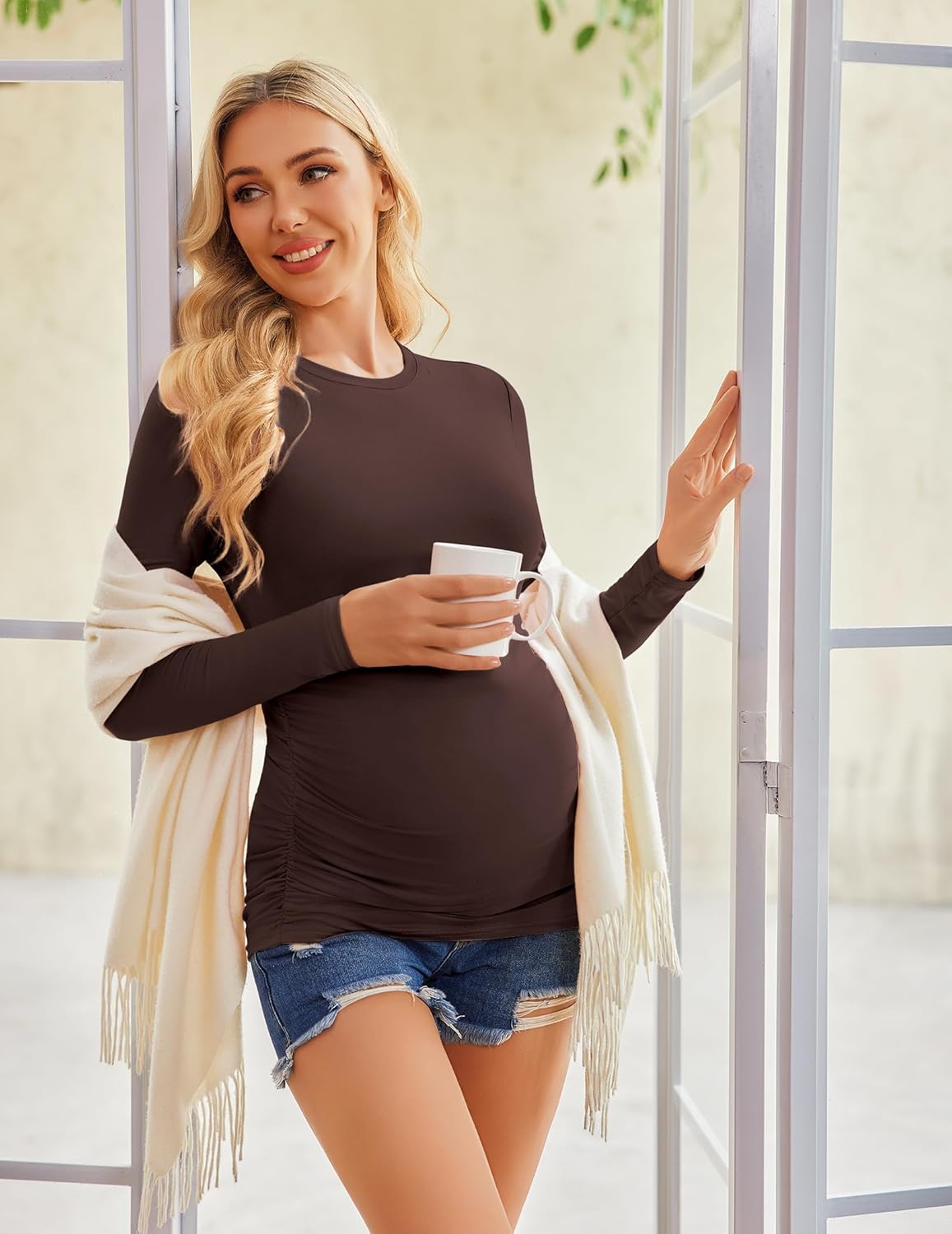 Dark brown long-sleeve maternity tee with crew neck and ruched waist