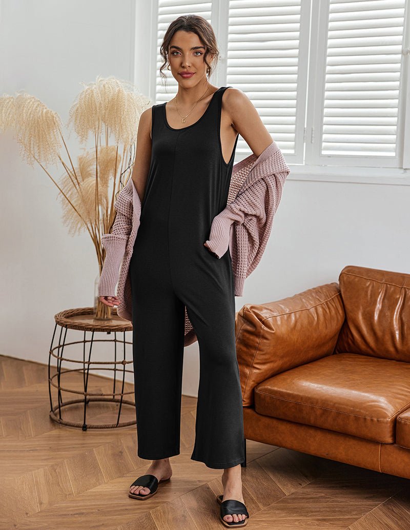Black sleeveless loose jumpsuit with front drape and wide cropped legs