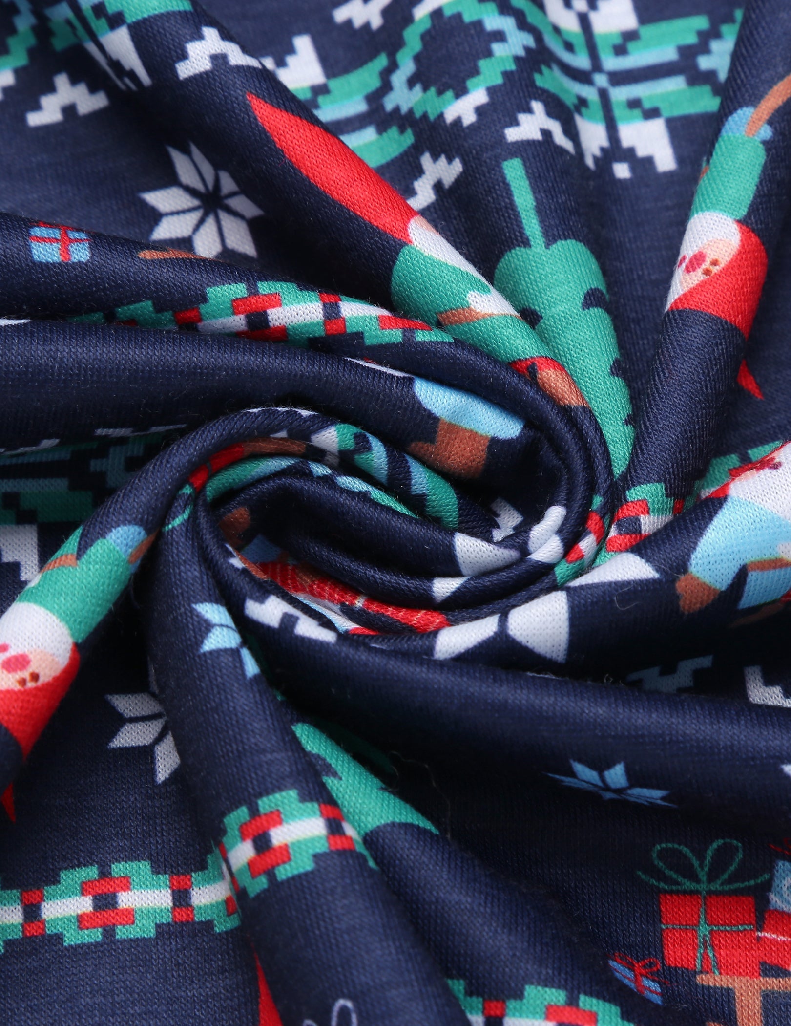Navy holiday print pajama fabric close-up with snowflake and gift motifs