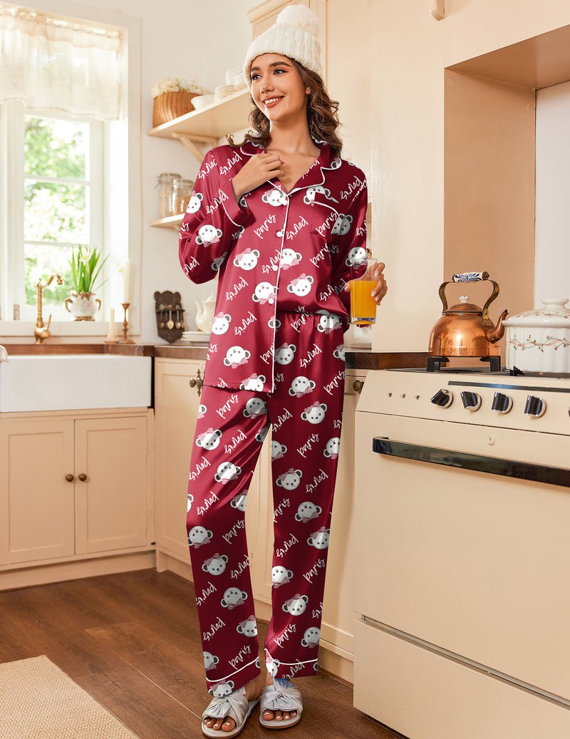 Burgundy satin pajama set with button-front top and allover cartoon print pants