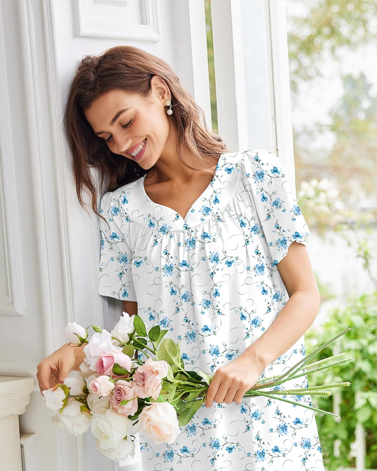 White cotton nightgown with blue floral pattern and embroidered neckline