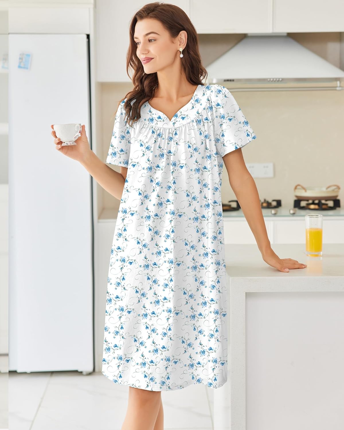 White cotton nightgown with blue floral print, short sleeves and embroidered trim
