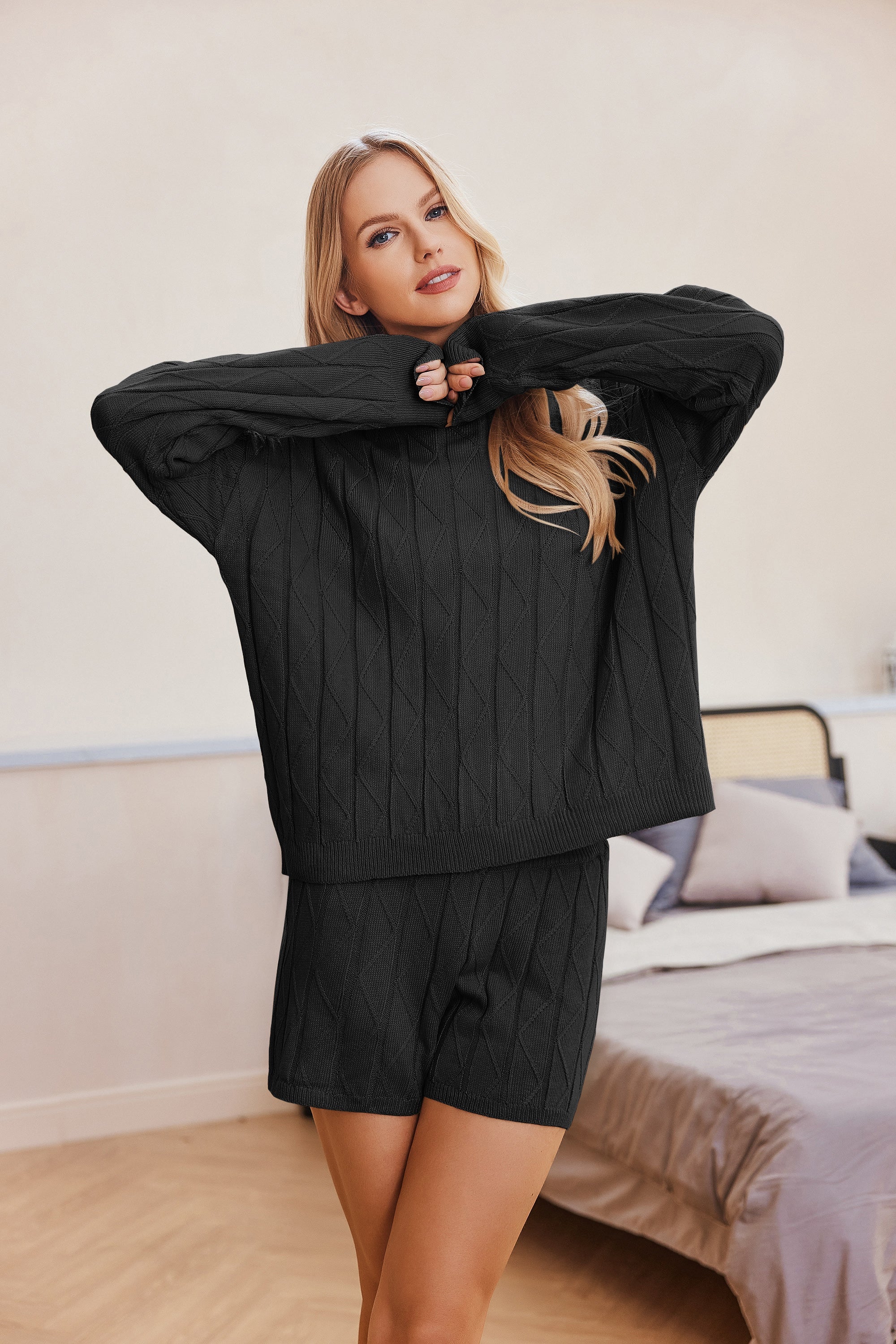 Black cozy knit sweatsuit set with long sleeves and matching shorts