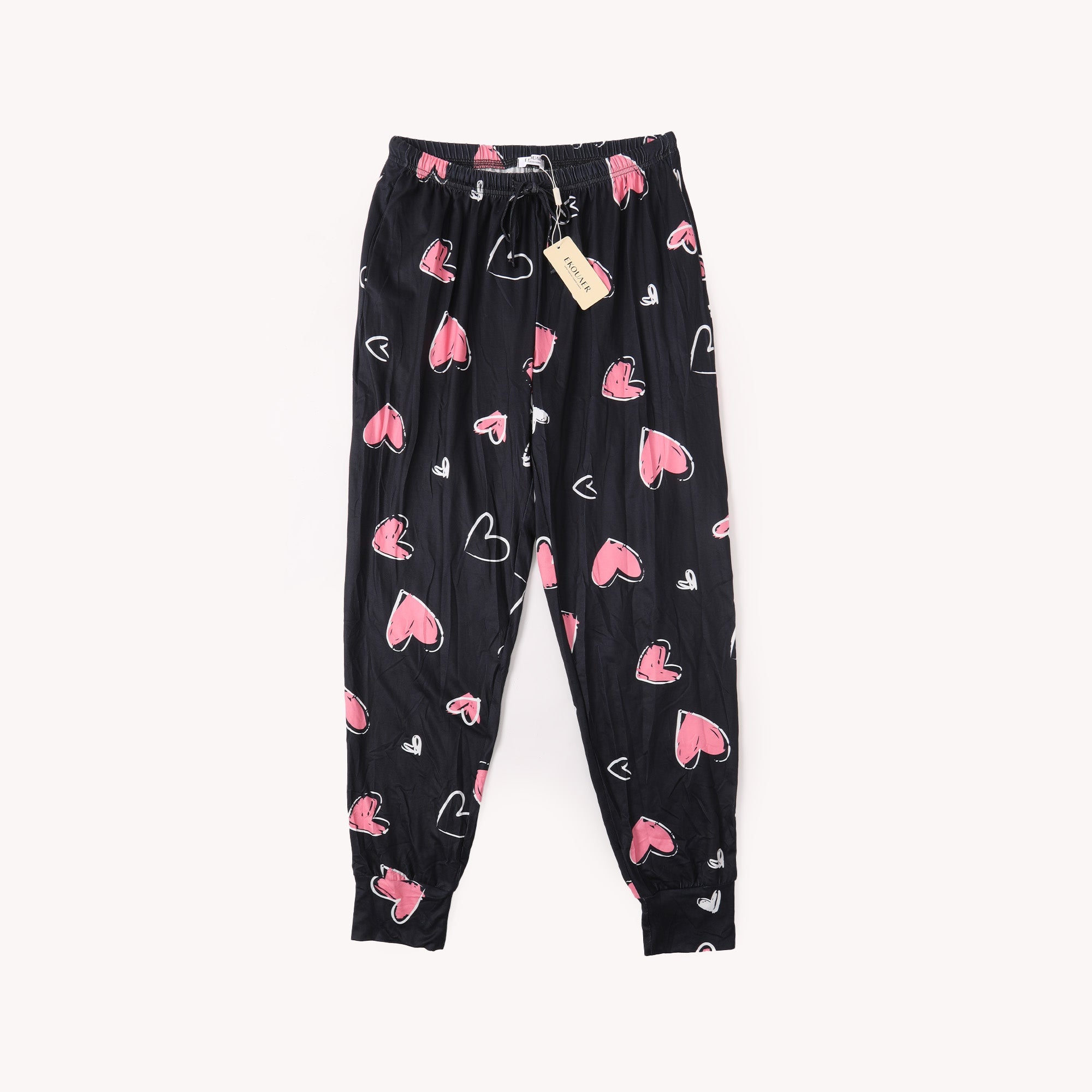 Black heart-printed pants with elastic waistband and drawstring; pink hearts