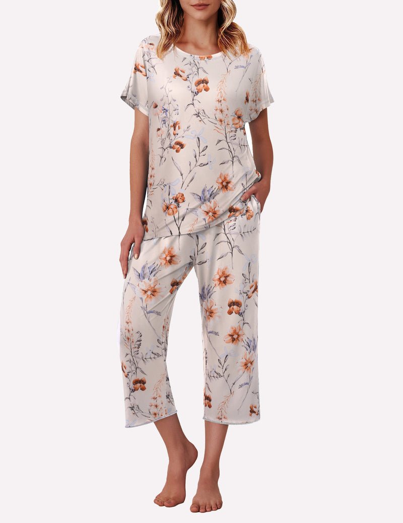 Beige floral pajama set with short sleeves and capri pants, side pockets