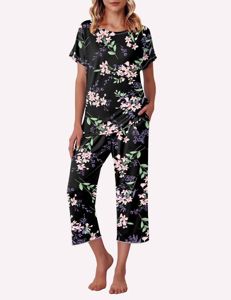 Black floral pajama set with pink blossoms, short-sleeve top and cropped pants