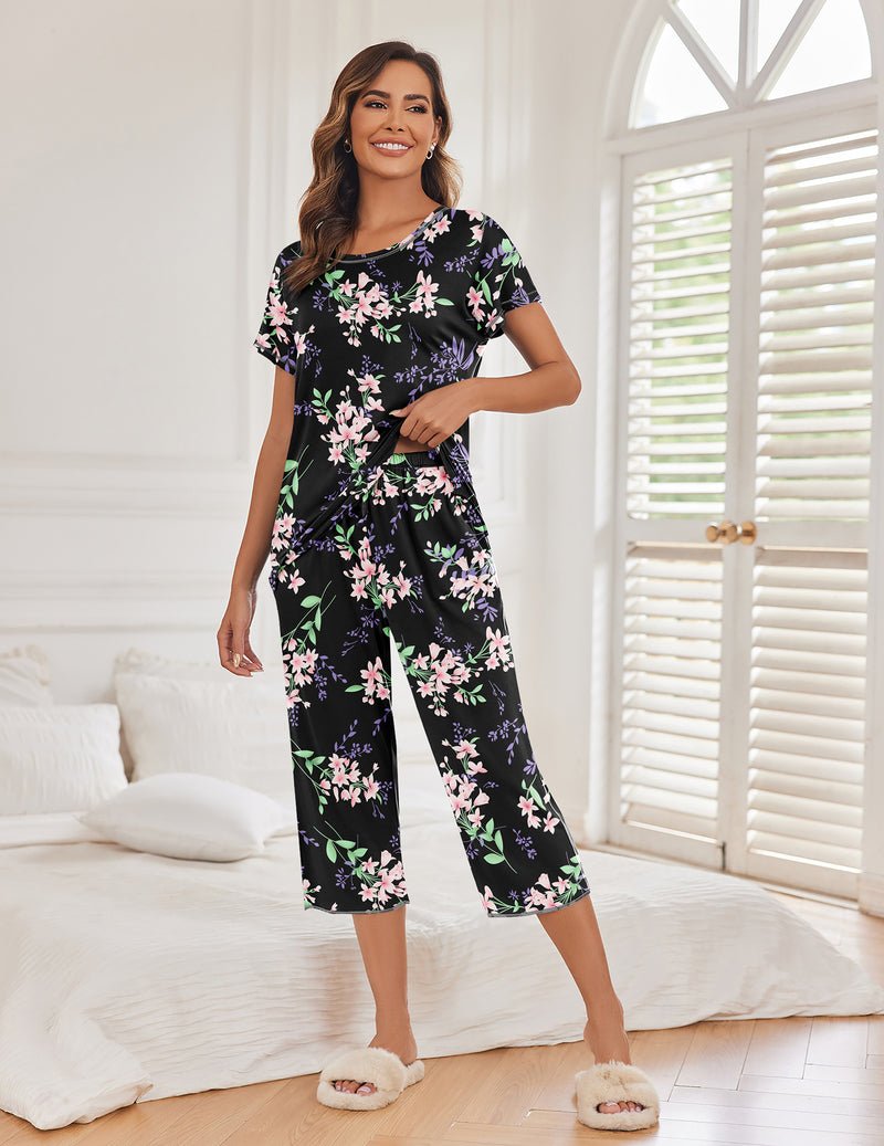 Black floral pajama set with short sleeves, cropped pants, drawstring-waist look