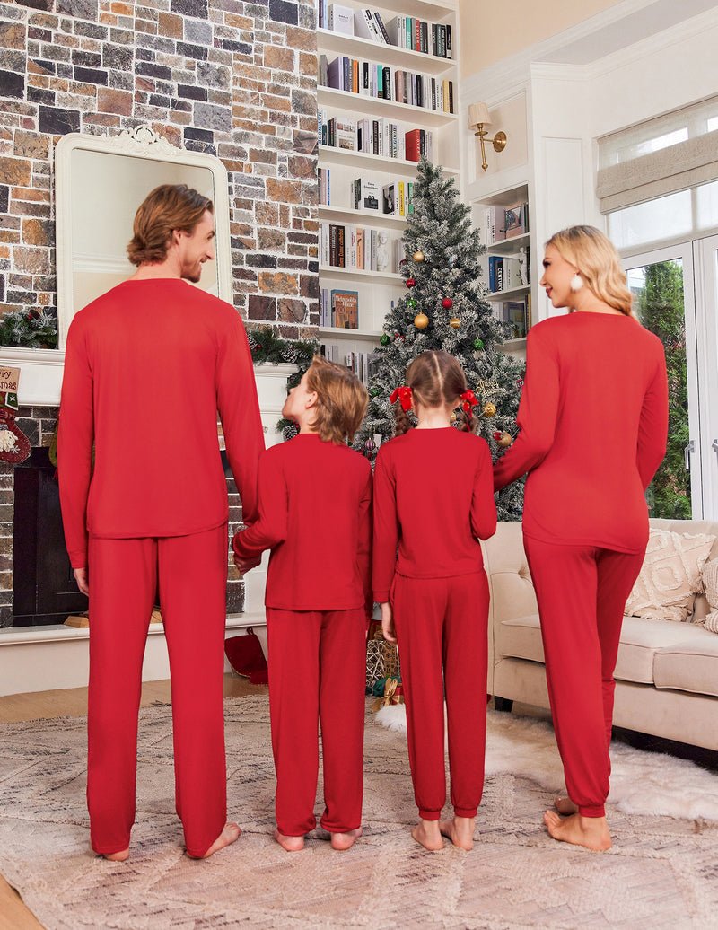Back view family Christmas pajamas: red long-sleeve tops and red pants