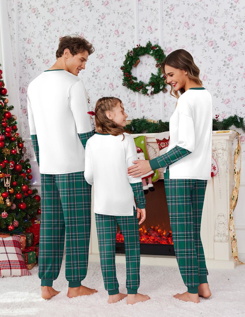 Back view: white kids pajama top with “They’re the Naughty Ones” and green plaid pants
