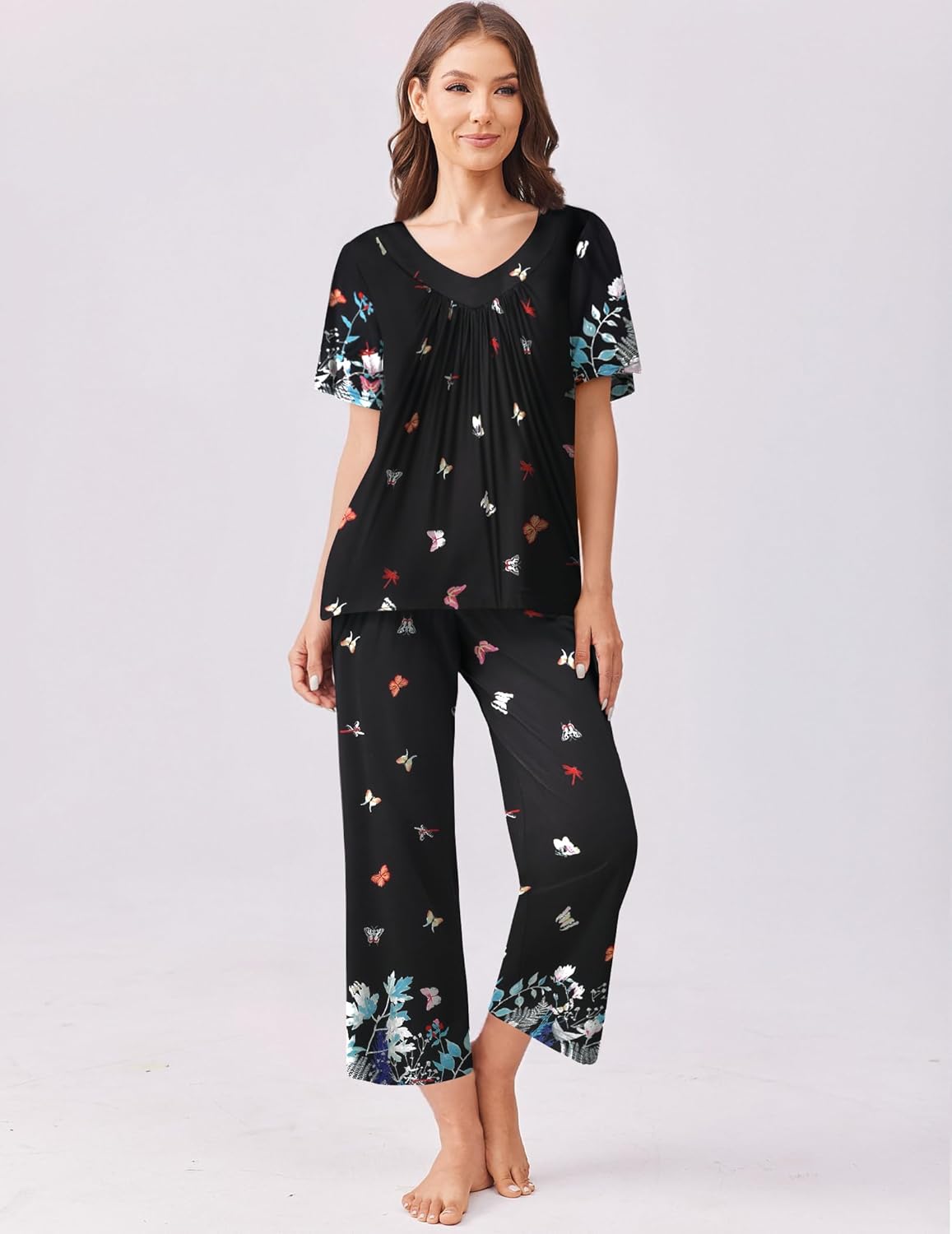 Black short-sleeve pajama top and capri pants set with colorful bird and floral print