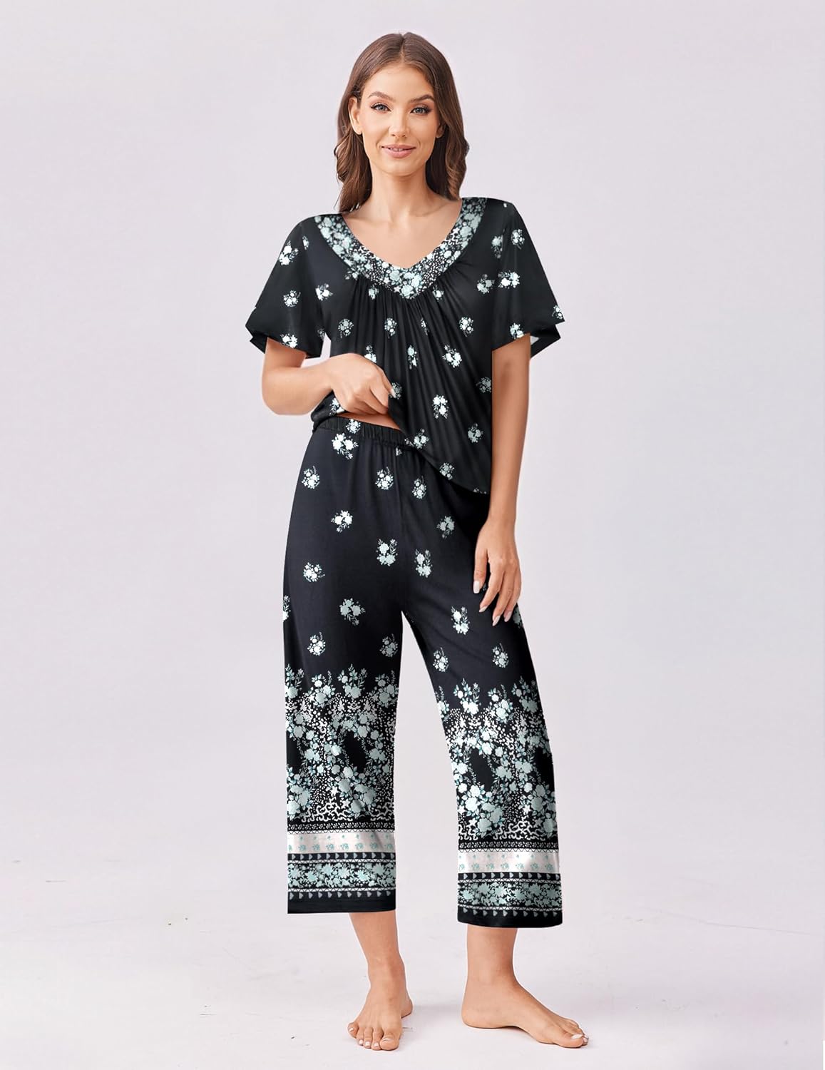 Black floral capri pajama set with gathered short-sleeve top and matching cropped pants