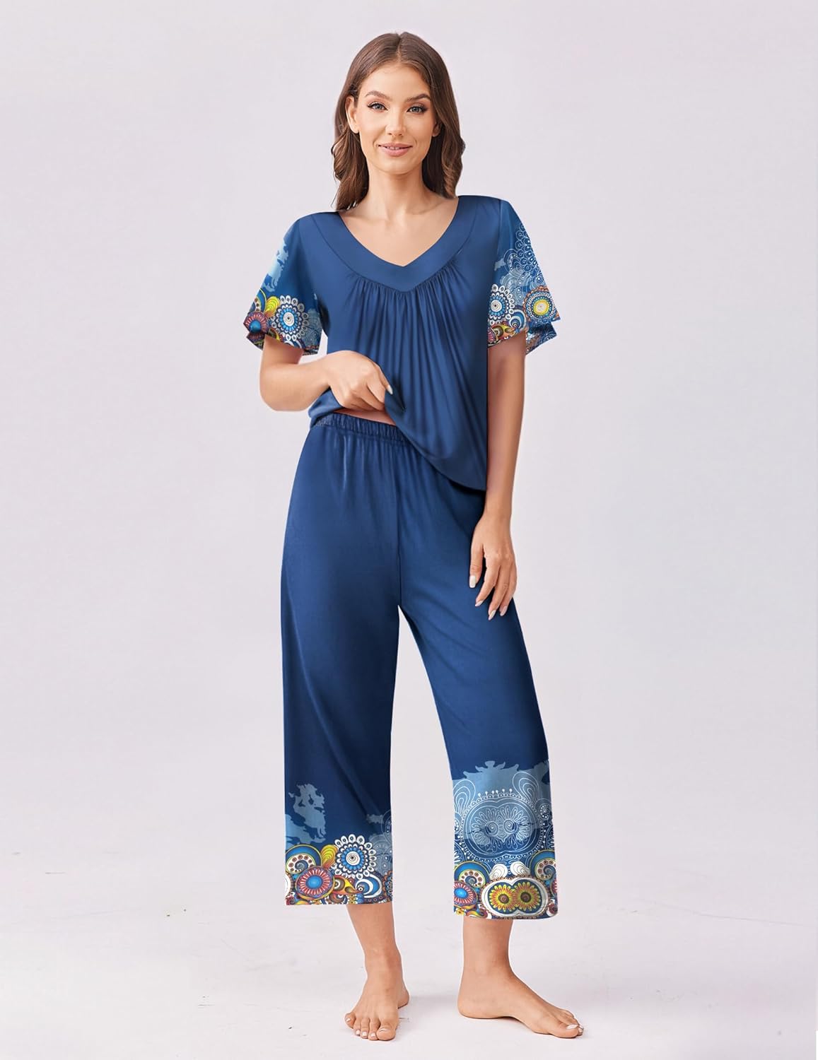 Blue short-sleeve pajama set with V-neck top and capri pants, all-over border print