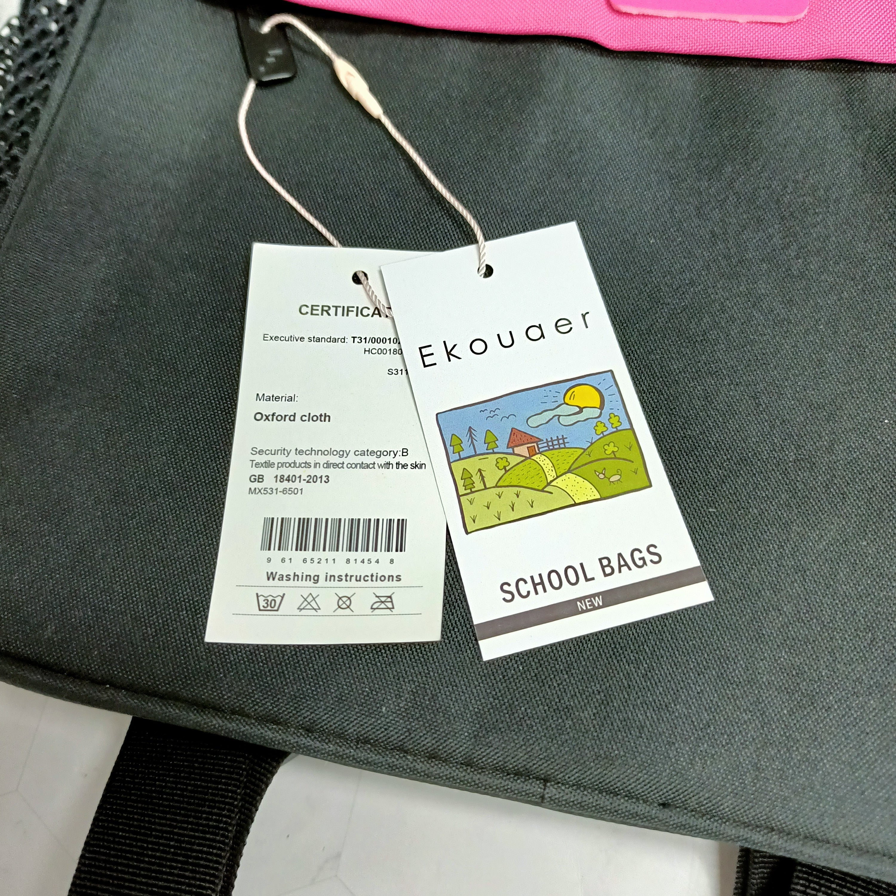 Backpack product tags with Ekouaer branding and certification card