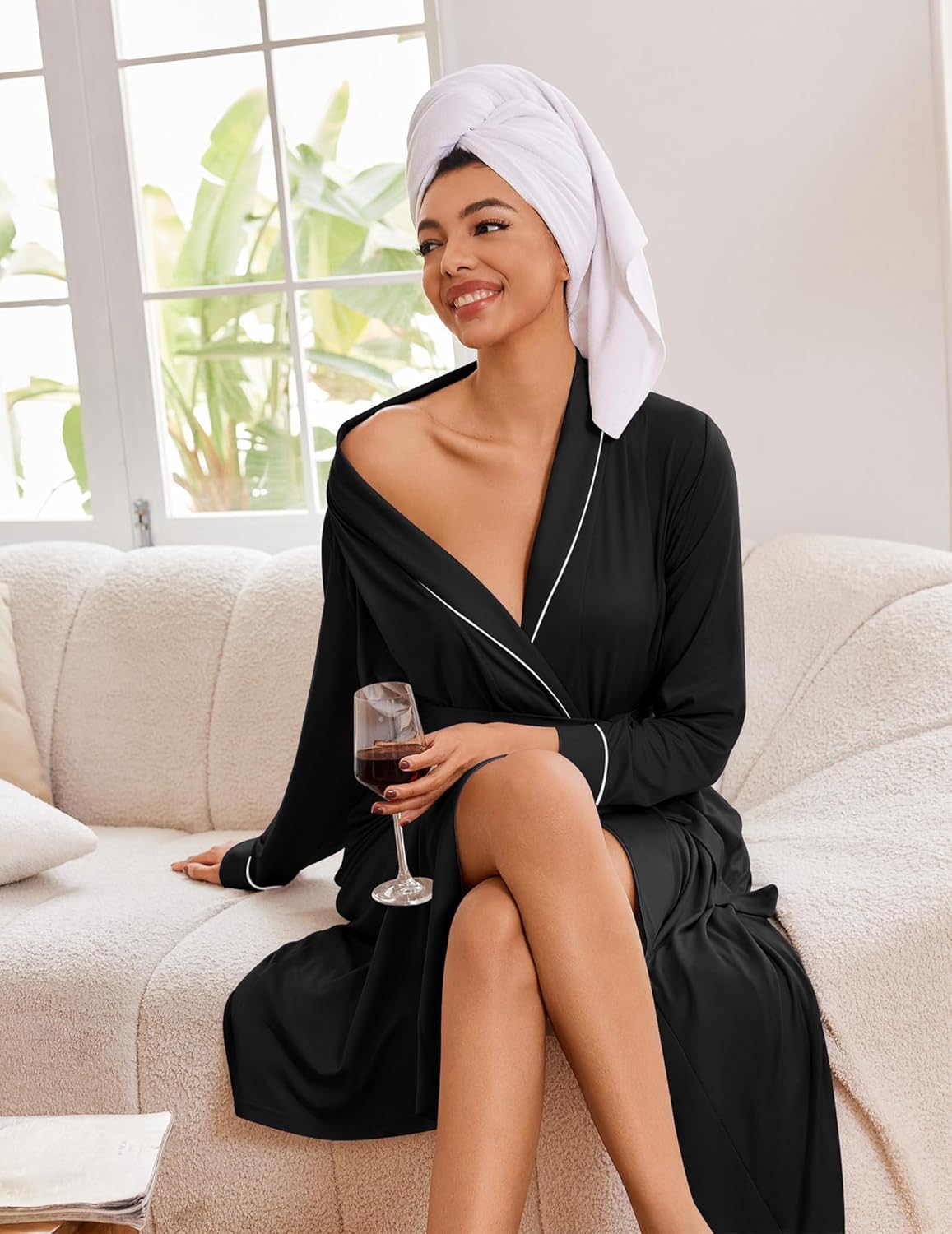 Black long kimono robe with contrast piping and tie waist, worn with headscarf