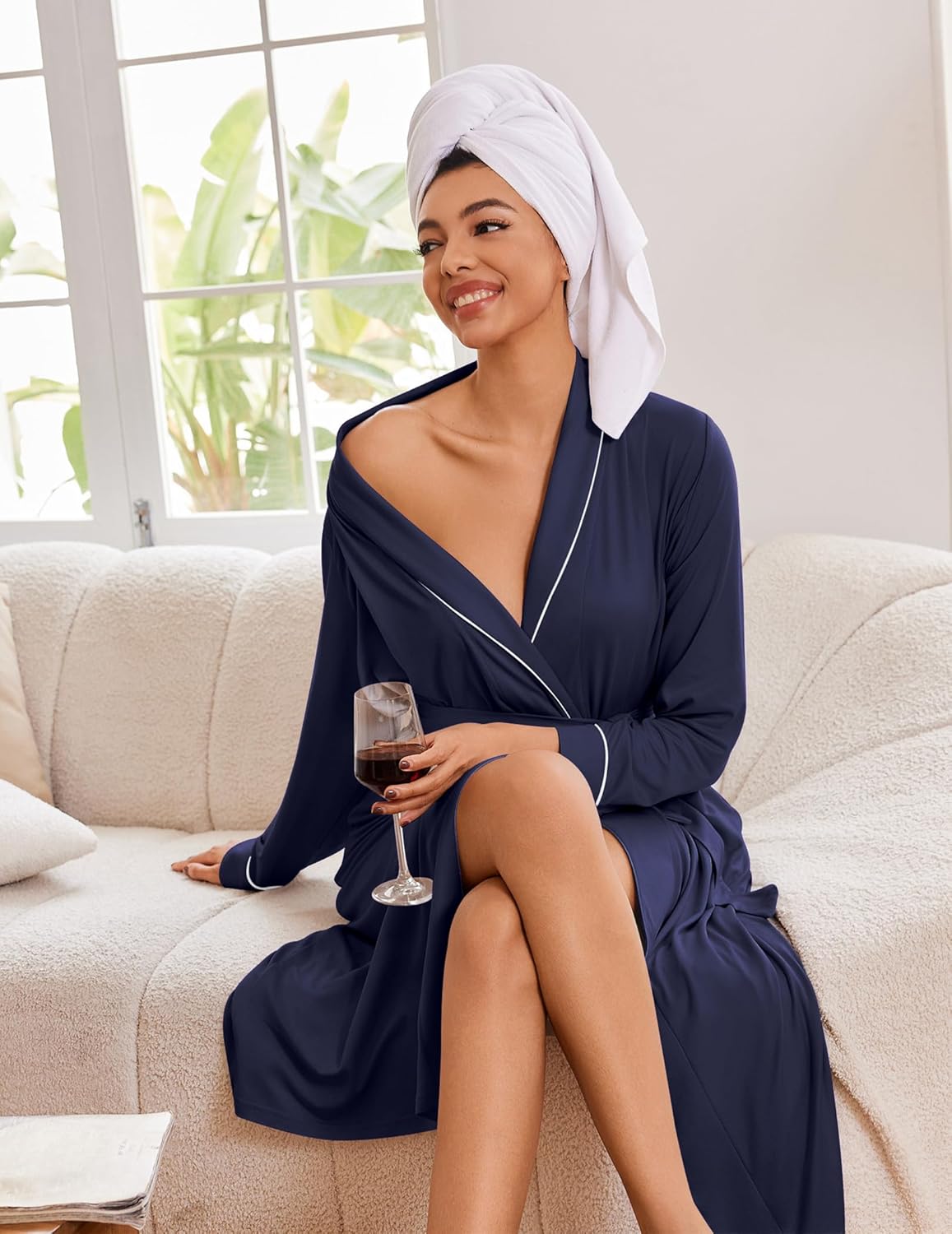 Dark blue kimono robe with white-trim piping, long sleeves, and waist tie