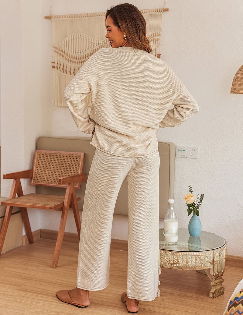 Cream knit pajama set from back: long-sleeve top and wide-leg pants