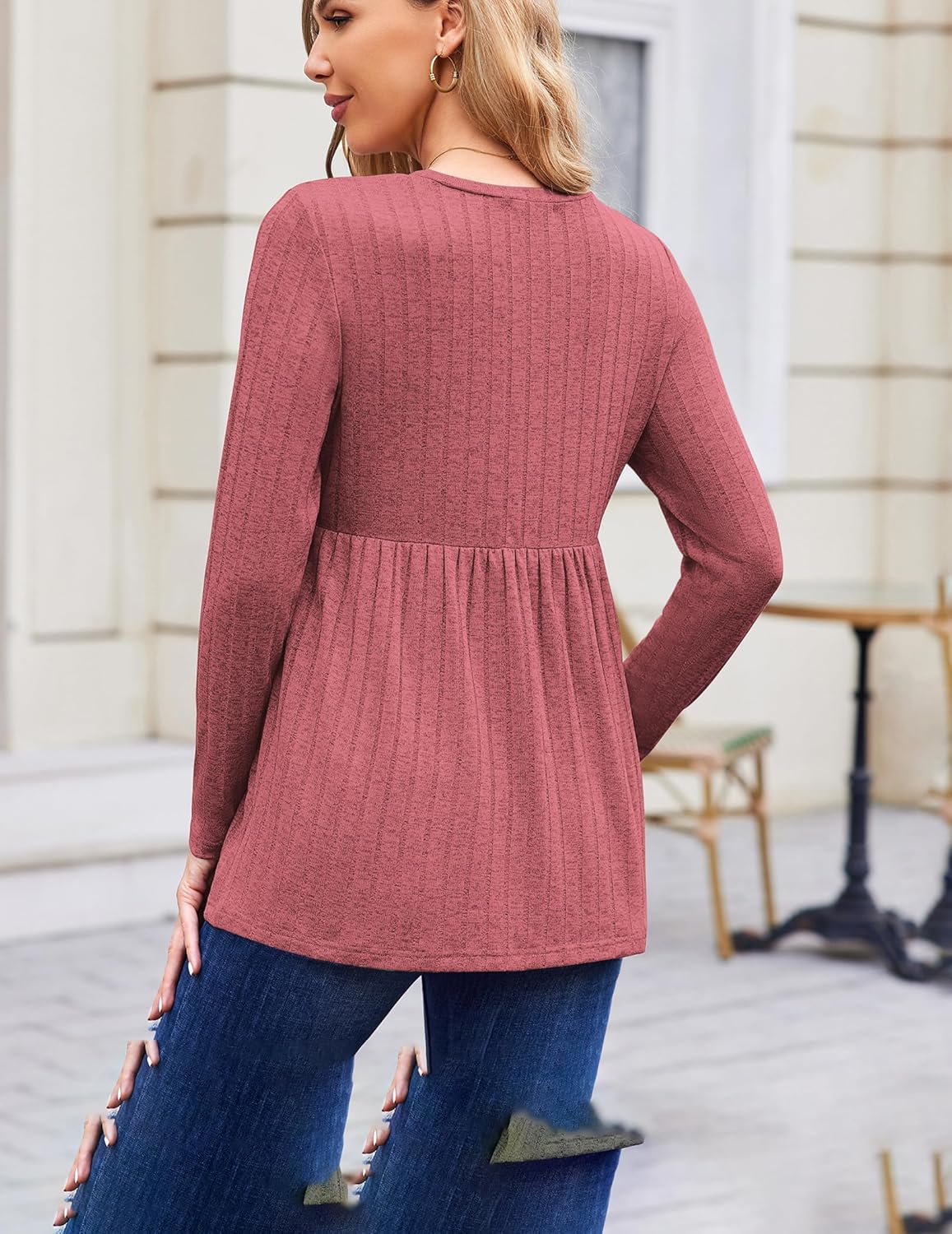 Back view: blush pink long-sleeve maternity tunic blouse with empire waist pleats