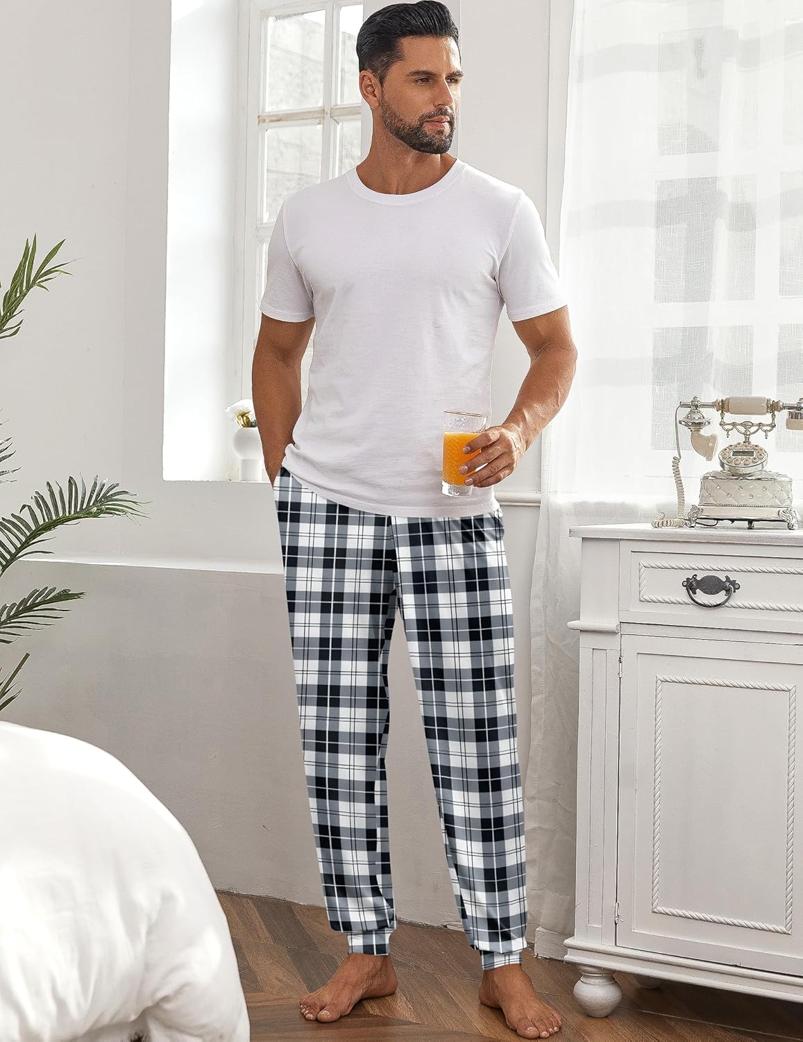 Men’s pajama pants in black-and-white plaid with drawstring waist