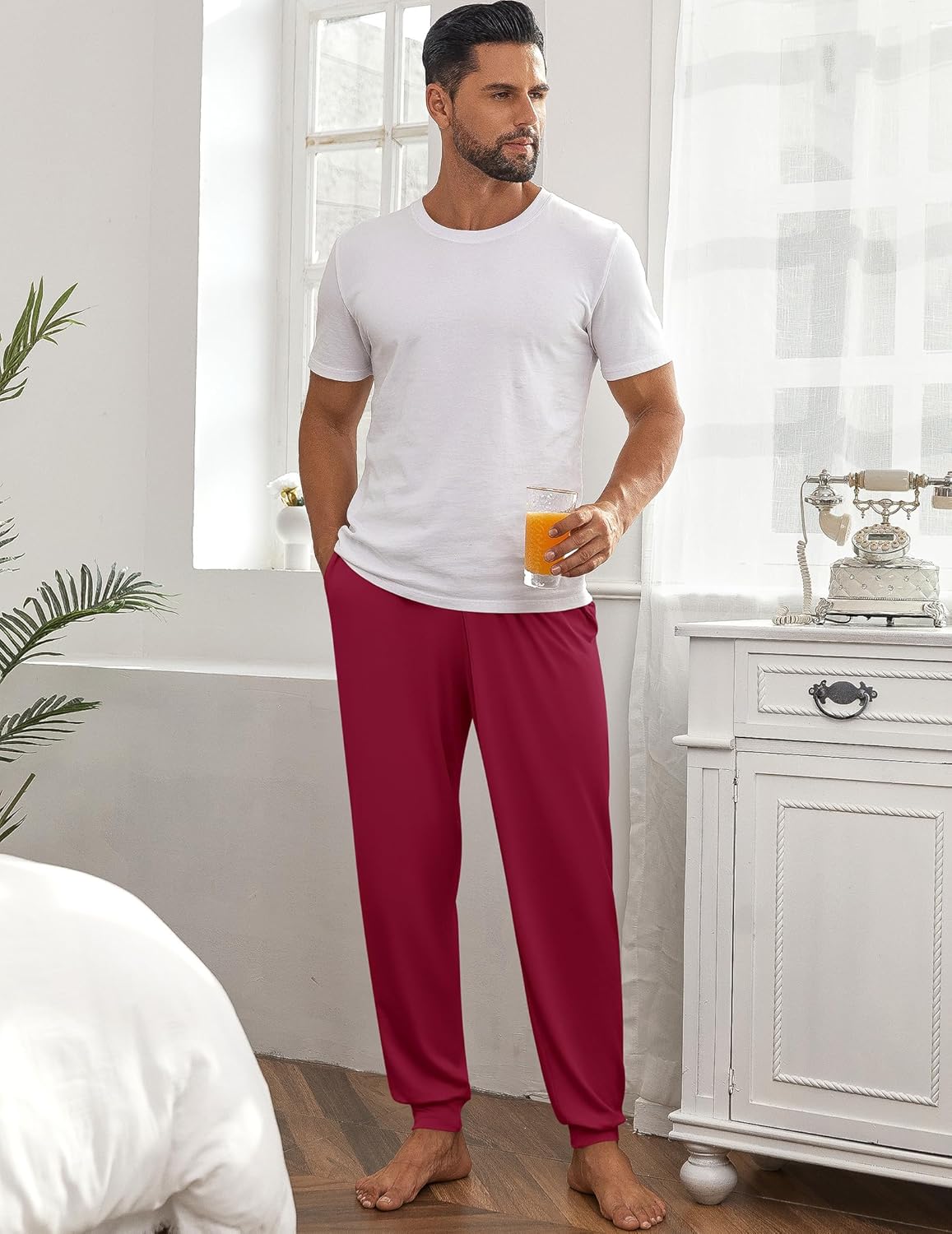 Men's pajama pants in deep red with elastic waistband and ankle cuffs