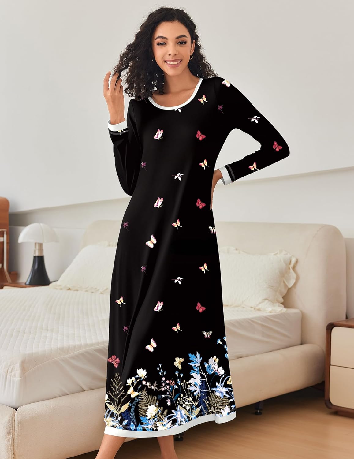 Black long-sleeve nightgown with butterfly prints, white trim at neckline and cuffs