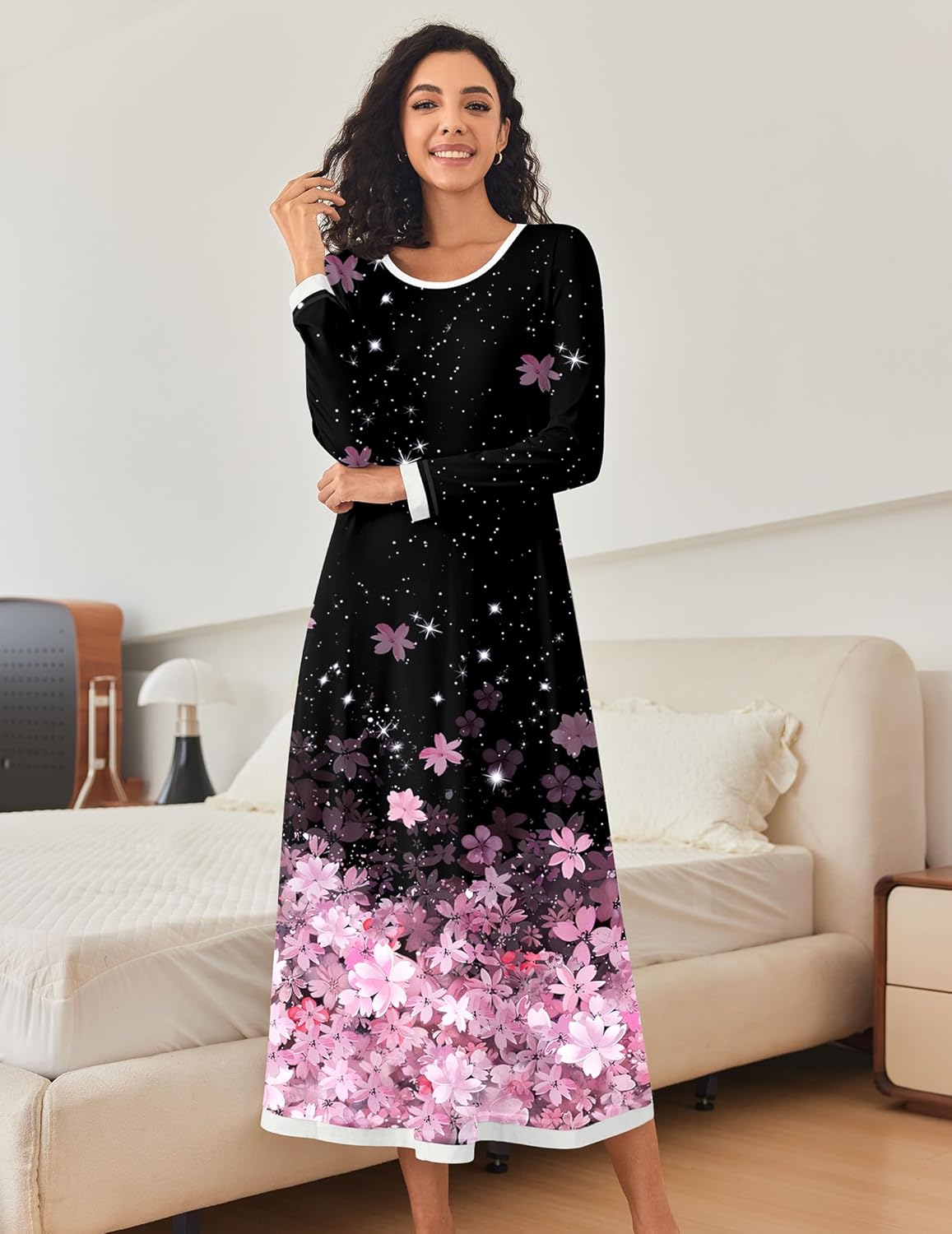 Black long-sleeve nightgown with star speckles, pink flowers and butterfly accents