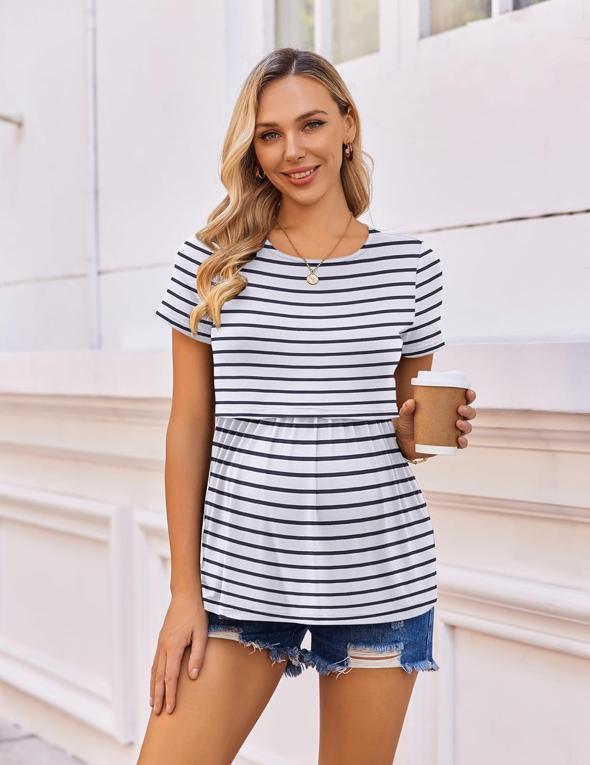 Black-and-white striped short-sleeve nursing tunic with empire waist.