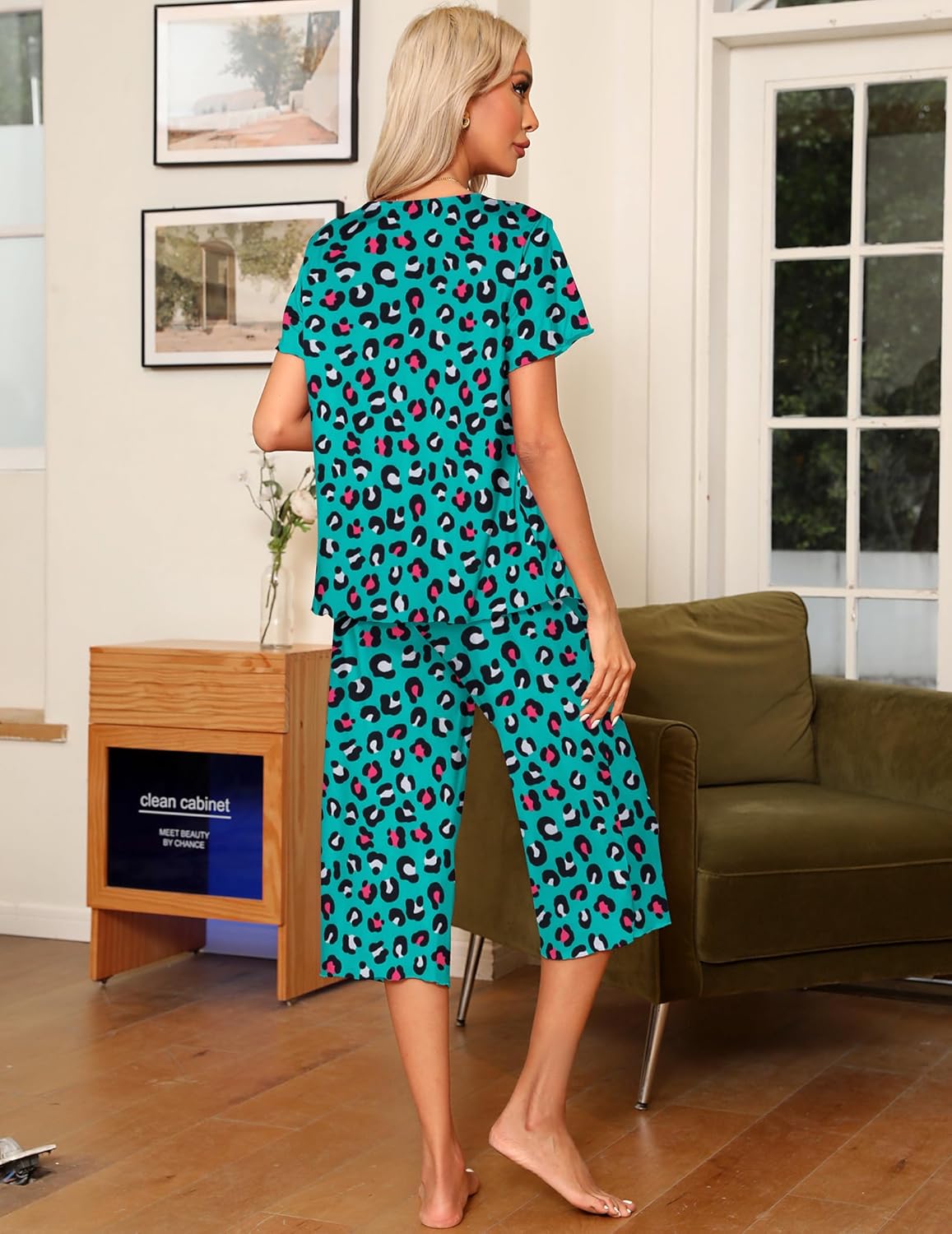 Back view, teal animal-print pajama set: short-sleeve top with capri pants