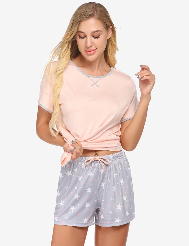 Pink pajama set with contrast piping and star-print drawstring shorts