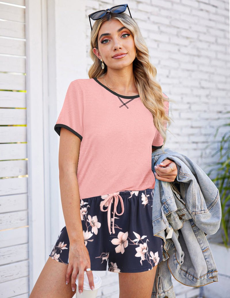 Pink short-sleeve pajama top with black floral drawstring shorts set