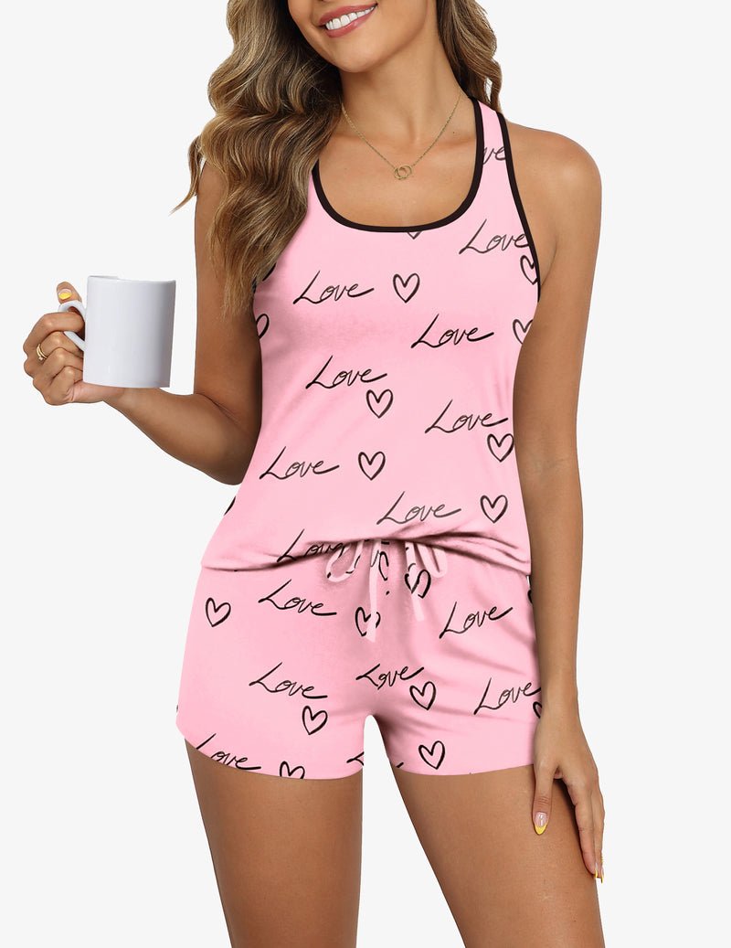 Pink sleeveless pajama top and shorts set with “Love” hearts print and tied waist