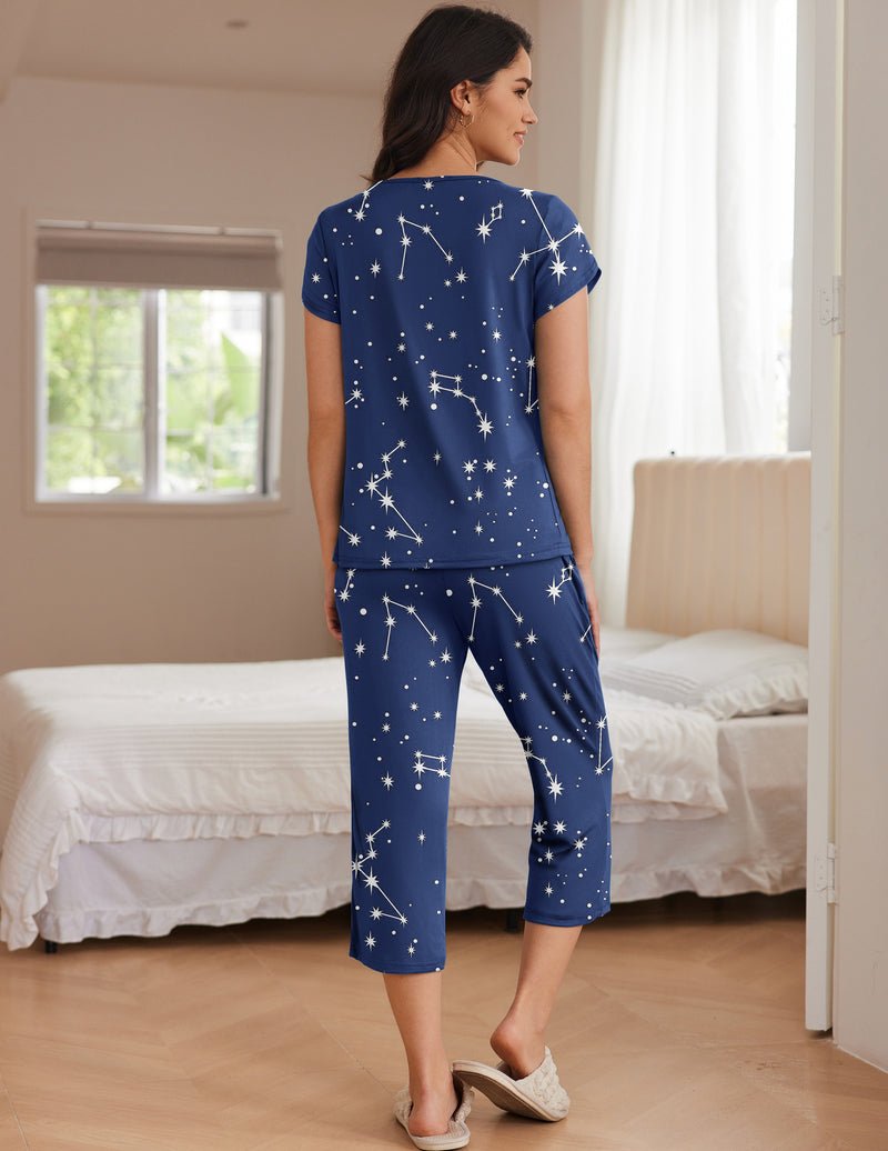Back view: navy star print short-sleeve pajama top and capri pants set