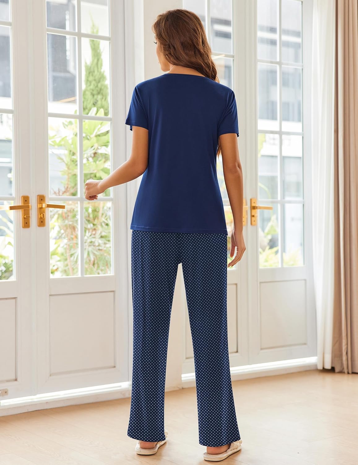 Two-piece pajama set in navy with short-sleeve top and dotted long pants, back view