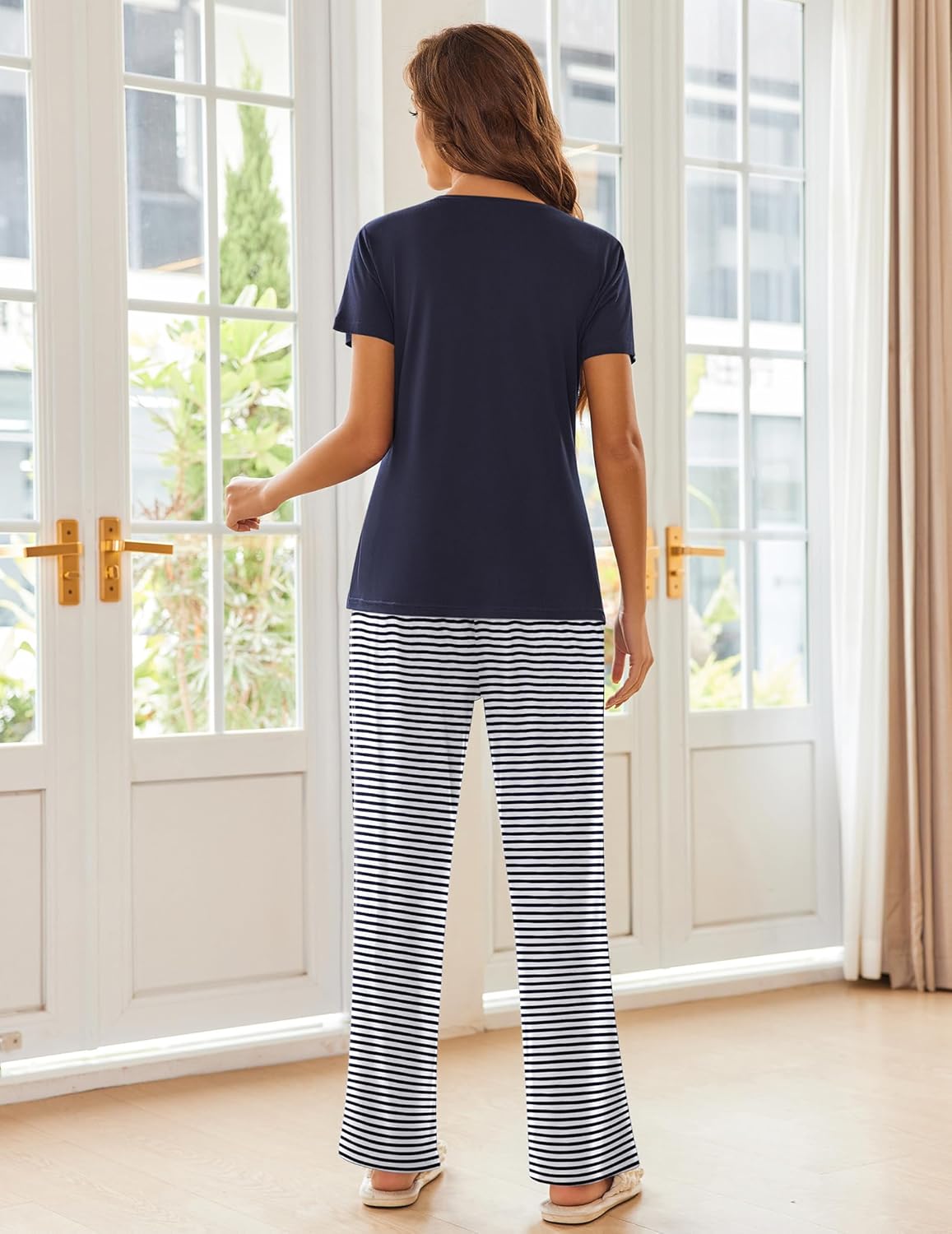Navy short-sleeve pajama top and black-and-white striped wide-leg pants
