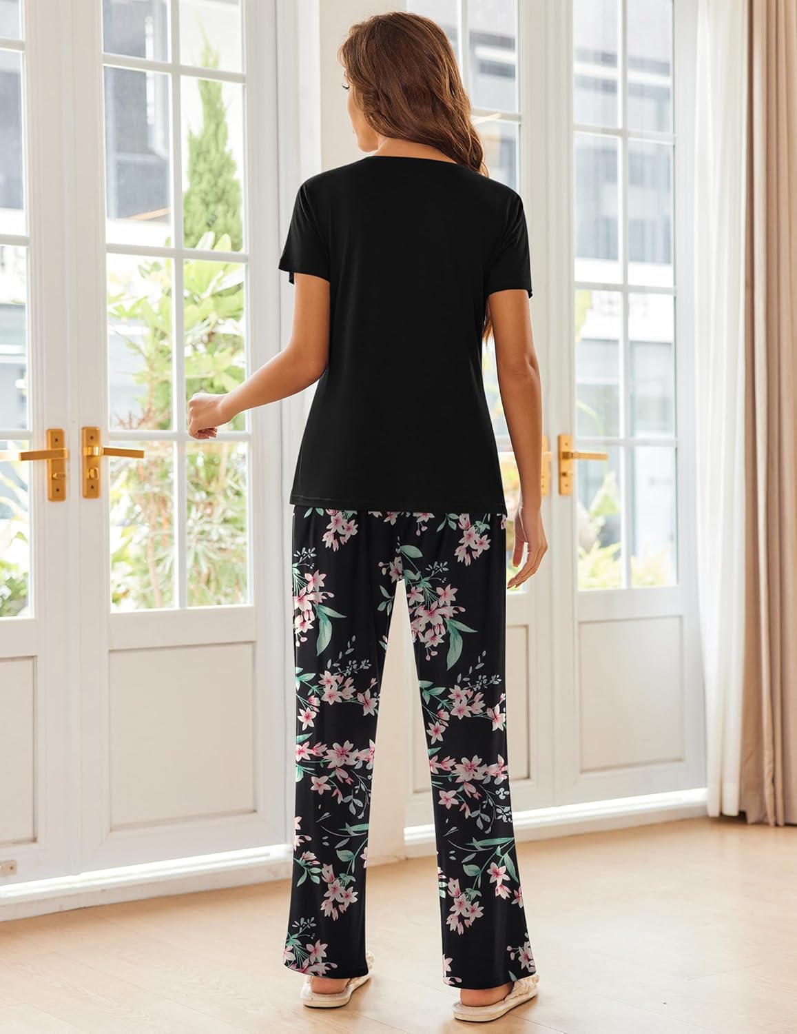 Black pajama set with floral pants, back view