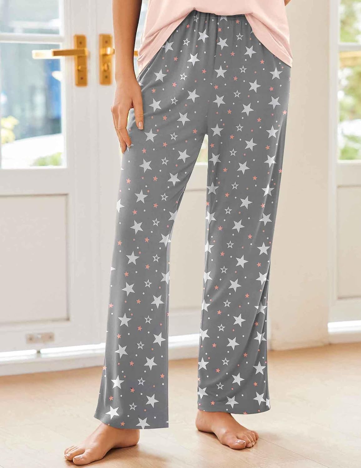 Women's pajama set with pink short-sleeve top and dark gray star pajama pants