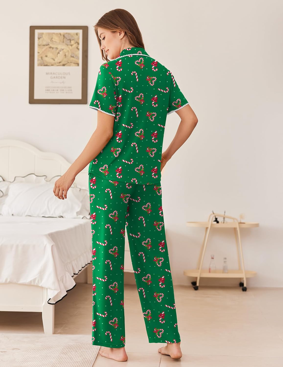 Green holiday pajama set with button-front top, long pants, and small print